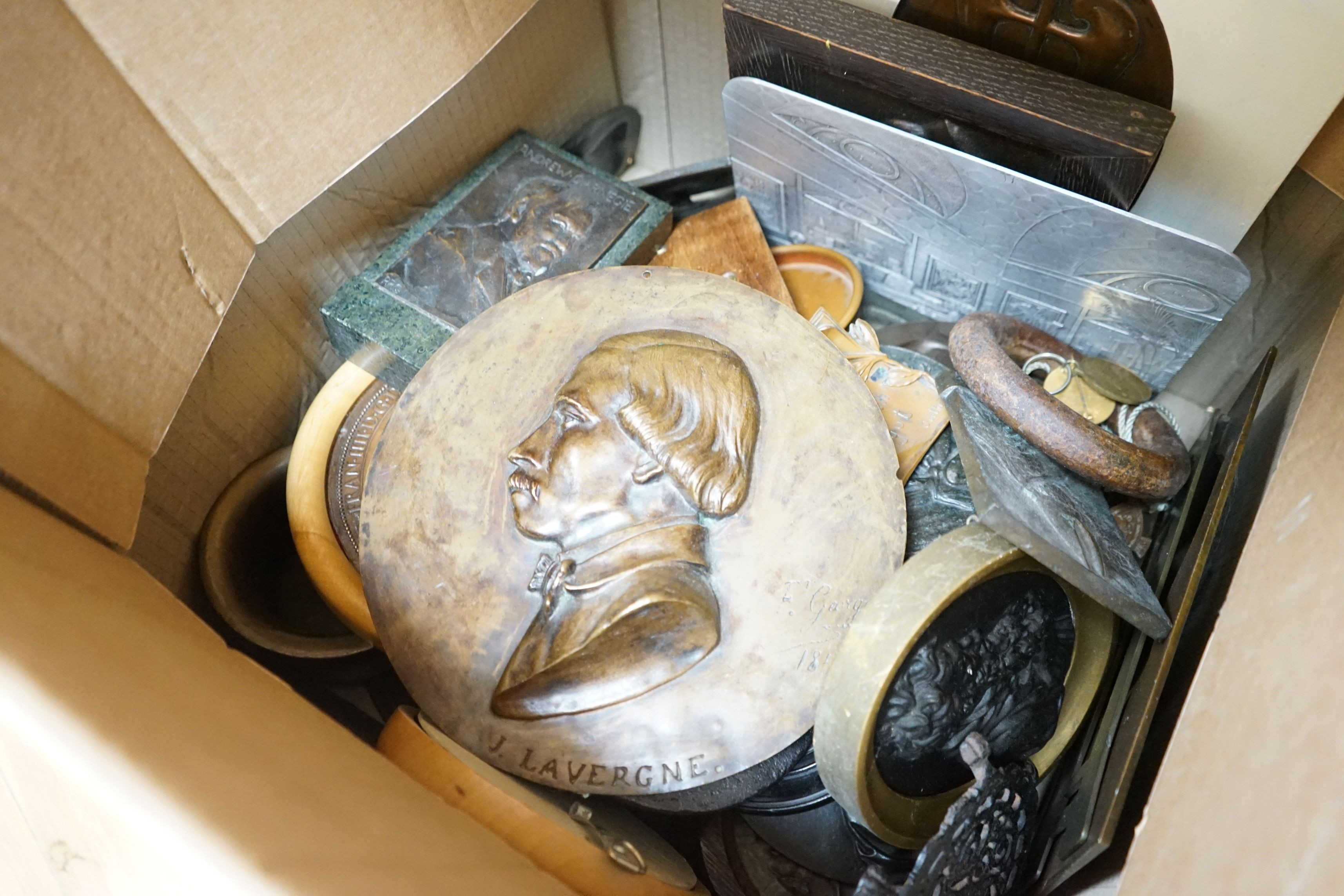 A large collection of mixed decorative metal plaques